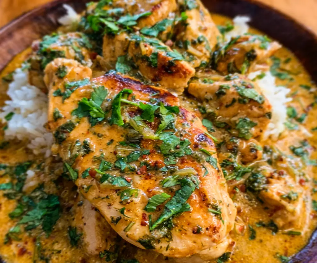 Delicious Back-Pocket Caper-Butter Chicken served on a plate garnished with fresh herbs.